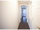 Bright hallway features an arched entrance, tiled flooring and neutral paint tones, creating a welcoming interior at 9526 Borough Park St, Las Vegas, NV 89178