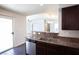 Modern kitchen with stainless steel appliances, granite counters, and access to the living space at 9526 Borough Park St, Las Vegas, NV 89178