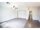 The spacious living area is enhanced by neutral paint, plush carpeting, and an elegant arched doorway at 9526 Borough Park St, Las Vegas, NV 89178