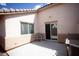 This is a cozy patio with furniture and a sliding door entrance, great for outdoor relaxation and entertainment at 9526 Borough Park St, Las Vegas, NV 89178