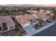 Desirable Sun City Summerlin property with neat landscaping, an attached garage, and a charming front patio at 9812 Folsom Dr, Las Vegas, NV 89134