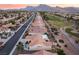 Beautiful aerial view of a Sun City Summerlin neighborhood with a lush golf course and mountain views at 9812 Folsom Dr, Las Vegas, NV 89134