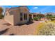 Charming backyard featuring desert landscaping and a view of the surrounding neighborhood at 9812 Folsom Dr, Las Vegas, NV 89134