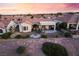Charming Sun City Summerlin home featuring a cozy backyard patio and well-maintained desert landscaping at 9812 Folsom Dr, Las Vegas, NV 89134