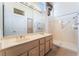 Ensuite bathroom with double sinks, large mirror, and walk-in shower at 9812 Folsom Dr, Las Vegas, NV 89134