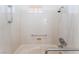 Handicap accessible tub and shower featuring grab bars at 9812 Folsom Dr, Las Vegas, NV 89134