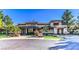 Attractive clubhouse with stone accents, mature trees, and well maintained landscaping at 9812 Folsom Dr, Las Vegas, NV 89134