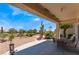 Comfortable covered patio with seating area, offering a relaxing outdoor space and desert views at 9812 Folsom Dr, Las Vegas, NV 89134