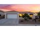 Inviting single-story home with a two-car garage and well-maintained desert landscaping at 9812 Folsom Dr, Las Vegas, NV 89134