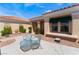 Inviting front patio area with comfortable seating and a charming garden with manicured greenery at 9812 Folsom Dr, Las Vegas, NV 89134