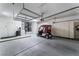 Clean garage with storage cabinets and parking for a golf cart at 9812 Folsom Dr, Las Vegas, NV 89134