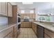 Well-equipped kitchen with light wood cabinetry, stainless steel appliances, and tile flooring at 9812 Folsom Dr, Las Vegas, NV 89134