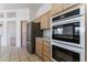 Modern kitchen with stainless steel refrigerator and ovens at 9812 Folsom Dr, Las Vegas, NV 89134