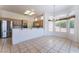 Eat-in kitchen features tile flooring, stainless steel appliances, and natural light from the dining area at 9812 Folsom Dr, Las Vegas, NV 89134