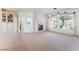 Bright living room features a fireplace, built-in bookcase, and large windows offering plenty of natural light at 9812 Folsom Dr, Las Vegas, NV 89134