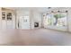 Bright living room features a fireplace, built-in bookcase, and large windows offering plenty of natural light at 9812 Folsom Dr, Las Vegas, NV 89134