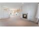 Spacious living room with tile fireplace, built-in bookcase, and lots of natural light at 9812 Folsom Dr, Las Vegas, NV 89134