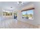 Bright living room features large windows, tile flooring, and views of the landscaped exterior at 9812 Folsom Dr, Las Vegas, NV 89134