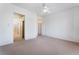 Bright main bedroom featuring carpet, a ceiling fan, and ensuite access at 9812 Folsom Dr, Las Vegas, NV 89134