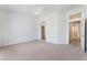 Large main bedroom with carpet, ceiling fan and access to the ensuite bath and walk-in closet at 9812 Folsom Dr, Las Vegas, NV 89134