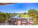 Outdoor bar with view of a golf course, lake, and a clear blue sky at 9812 Folsom Dr, Las Vegas, NV 89134