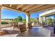 Covered patio with outdoor seating and views of the golf course at 9812 Folsom Dr, Las Vegas, NV 89134