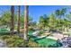 Scenic putting green nestled among trees and flowering bushes at 9812 Folsom Dr, Las Vegas, NV 89134