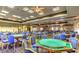Large recreation room with many tables and chairs for games and other activities at 9812 Folsom Dr, Las Vegas, NV 89134