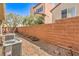 Landscaped backyard showing block wall, gravel, and air conditioning units at 9822 Opal Bridge Ct, Las Vegas, NV 89178