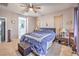 Comfortable bedroom featuring soft lighting, neutral tones, and a walk-in closet at 9822 Opal Bridge Ct, Las Vegas, NV 89178