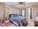 Inviting bedroom with plush carpeting, a ceiling fan, and access to the outside at 9822 Opal Bridge Ct, Las Vegas, NV 89178