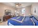 Relaxing bedroom showcasing a dresser and mirror, as well as access to a bathroom at 9822 Opal Bridge Ct, Las Vegas, NV 89178
