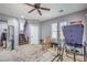 Upstairs bonus room with ceiling fan, natural light, and ample space for exercise equipment and activities at 9822 Opal Bridge Ct, Las Vegas, NV 89178