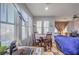 Cozy dining area with natural light, wood furniture, and stylish decor at 9822 Opal Bridge Ct, Las Vegas, NV 89178