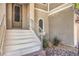 Inviting front entrance with decorative stone accents and steps leading to the front door at 9822 Opal Bridge Ct, Las Vegas, NV 89178