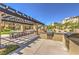Community outdoor grilling area with two large grills and picnic tables at 9822 Opal Bridge Ct, Las Vegas, NV 89178