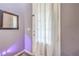 Neutral hallway features a white door and a modern mirror, creating a welcoming entrance at 9822 Opal Bridge Ct, Las Vegas, NV 89178