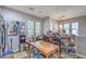 Bright kitchen space with ample storage, a wooden table, and views of the exterior at 9822 Opal Bridge Ct, Las Vegas, NV 89178