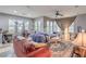 Bright living room with natural light, neutral walls, and comfortable seating arrangement at 9822 Opal Bridge Ct, Las Vegas, NV 89178