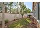 Serene backyard with a well-maintained lawn, trees, and a fenced perimeter for privacy and relaxation at 10017 Snow Crest Pl, Las Vegas, NV 89134