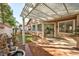 Inviting backyard with covered patio, manicured lawn, and lush landscaping, perfect for entertaining at 10017 Snow Crest Pl, Las Vegas, NV 89134