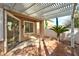 Covered patio with textured floor, easy access to the house, overlooking a landscaped yard at 10017 Snow Crest Pl, Las Vegas, NV 89134