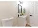 Cozy bathroom features toilet, and modern vanity with black fixtures at 10017 Snow Crest Pl, Las Vegas, NV 89134