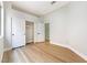 Neutral bedroom with wood floors, closet, and an ensuite door at 10017 Snow Crest Pl, Las Vegas, NV 89134