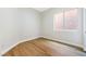 Empty bedroom with wood flooring and ample natural light from window at 10017 Snow Crest Pl, Las Vegas, NV 89134