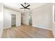 Expansive bedroom with wood floors and multiple doors leading to other rooms at 10017 Snow Crest Pl, Las Vegas, NV 89134