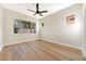 Bright bedroom featuring wood floors, recessed lighting, and large windows at 10017 Snow Crest Pl, Las Vegas, NV 89134