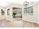 Bright dining space offers wood floors and large windows overlooking the backyard at 10017 Snow Crest Pl, Las Vegas, NV 89134