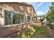Exterior view showcases a well-maintained house with a pergola-covered patio and landscaped backyard at 10017 Snow Crest Pl, Las Vegas, NV 89134