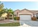 Lovely single-story house with a well-kept lawn, tasteful landscaping, and a two-car attached garage at 10017 Snow Crest Pl, Las Vegas, NV 89134